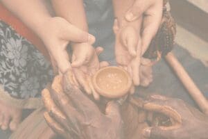 Anita Mendiratta Foundation hands in clay